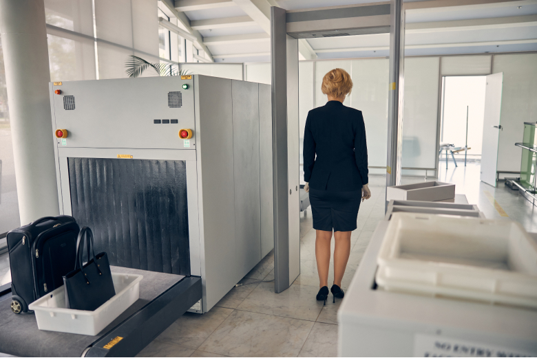 elegant-woman-walking-through-security-control-gat-2023-11-27-04-49-29-utc 1